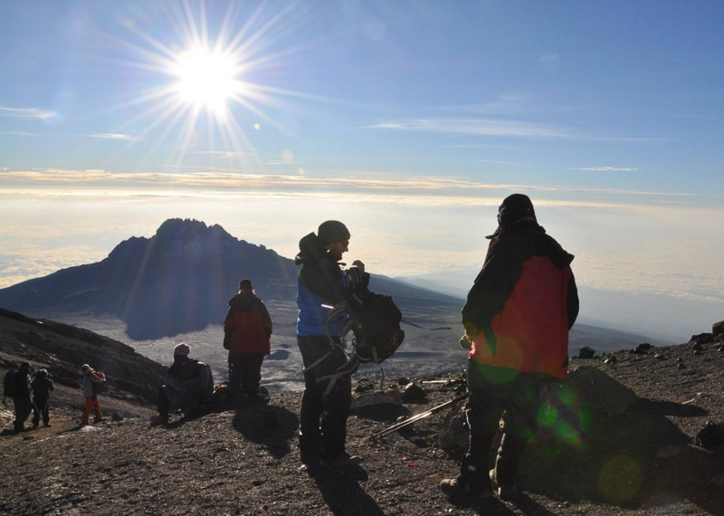 A group of trekkers climbing mount Kilimanjaro