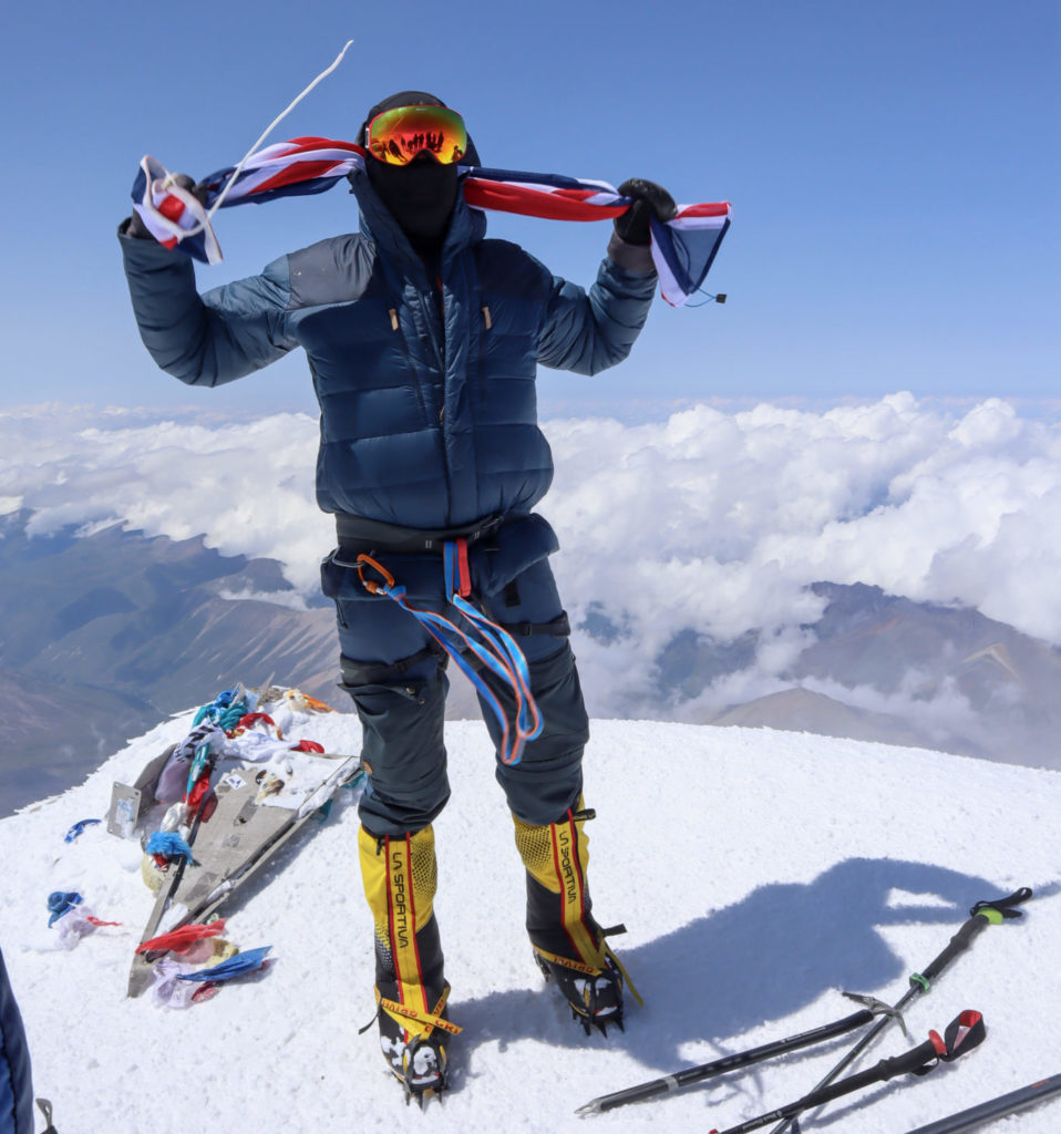 Mark standing on Europes highest peak, Mount Elbrus.